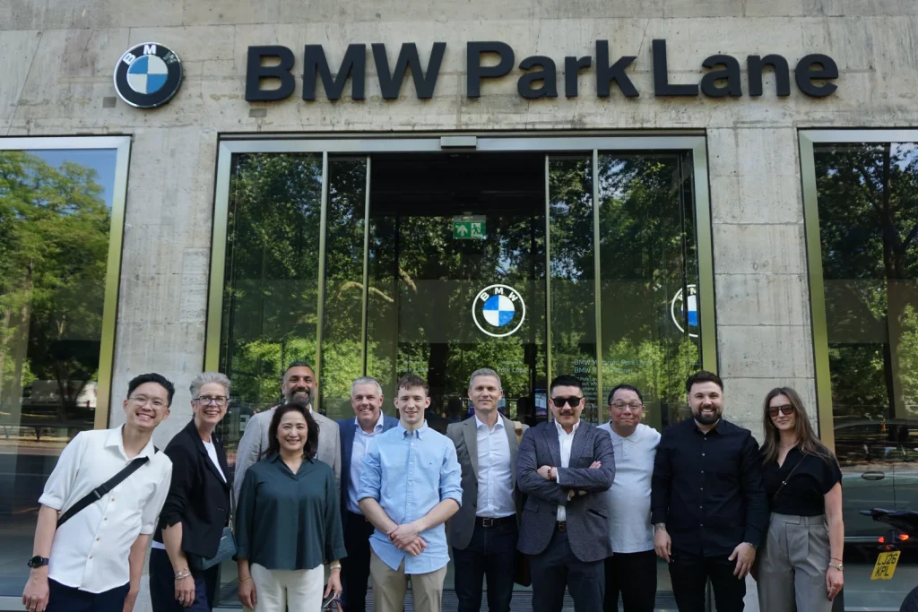 Group Stand In Front Of Bmw Park Lane At