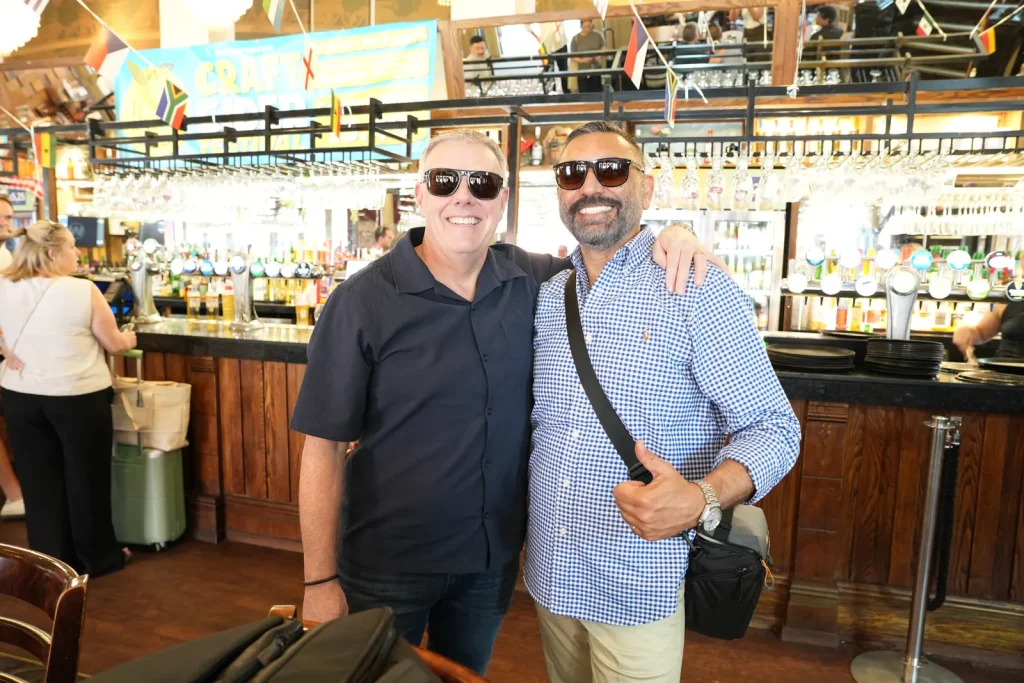 Two Men Smiling At A Pub At The Bmw Aust