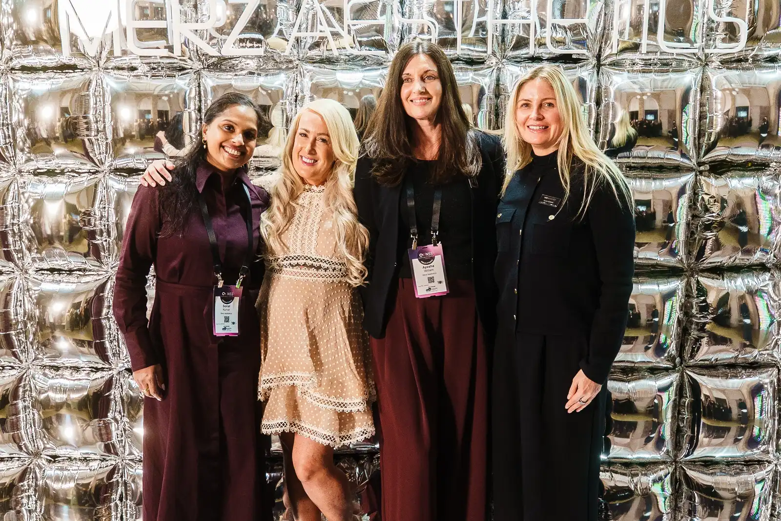 Group photo in front of Merz Aesthetics logo at the Merz Aesthetics Ultherapy PRIME Launch & Showcase Dinner – Peanut Productions case study