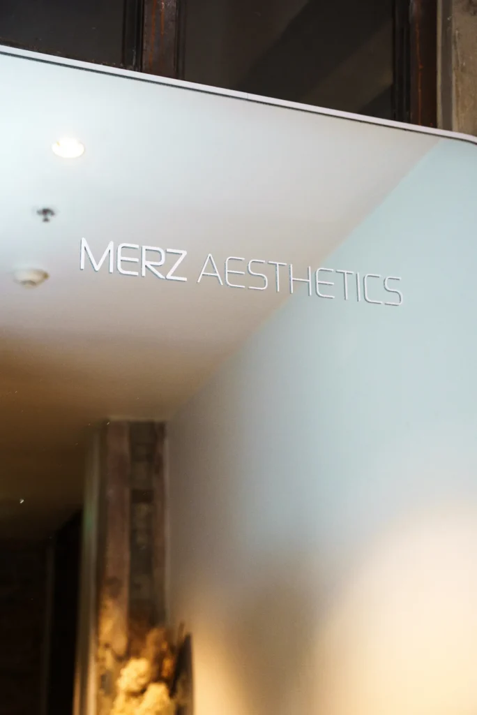 Close up of the Merz Aesthetics logo on a reflective surface at the Merz Aesthetics Ultherapy PRIME Launch & Showcase Dinner – Peanut Productions case study