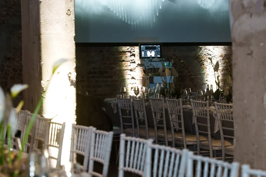 Tables and screen at the Merz Aesthetics Ultherapy PRIME Launch & Showcase Dinner – Peanut Productions case study