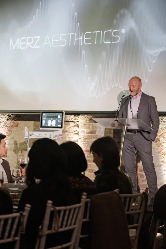 Presenter on stage at the Merz Aesthetics Ultherapy PRIME Launch & Showcase Dinner – Peanut Productions case study